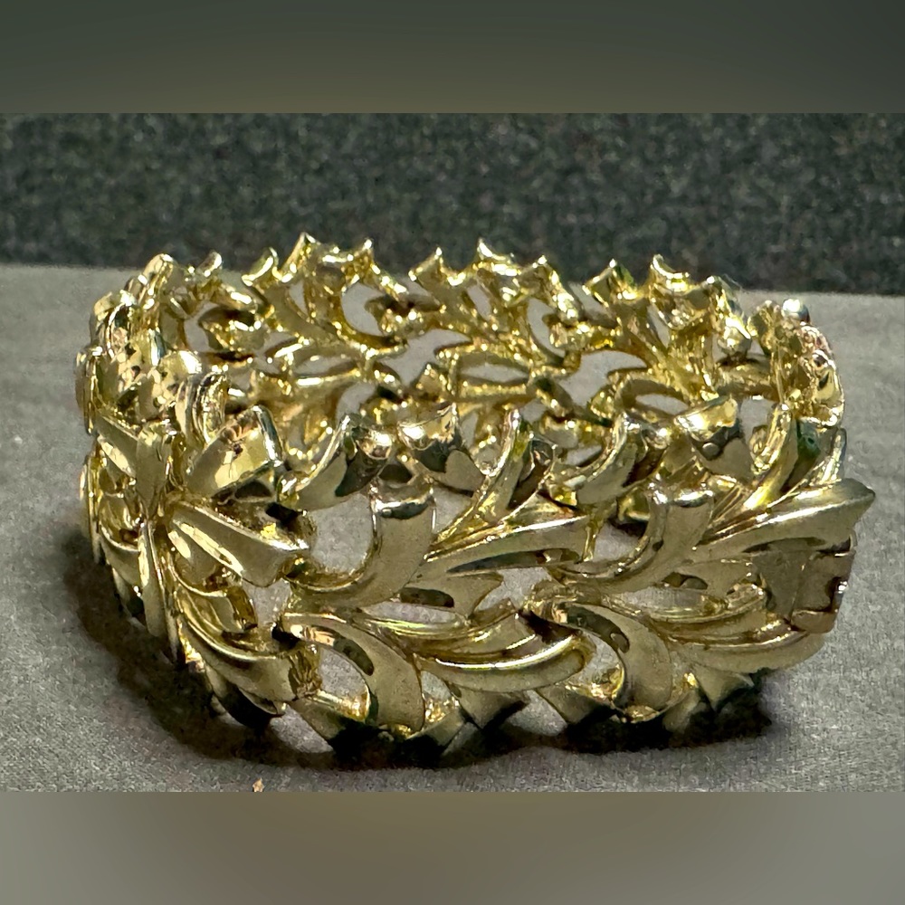 Gold Toned Metal Bracelet Designed in a Floral Pattern